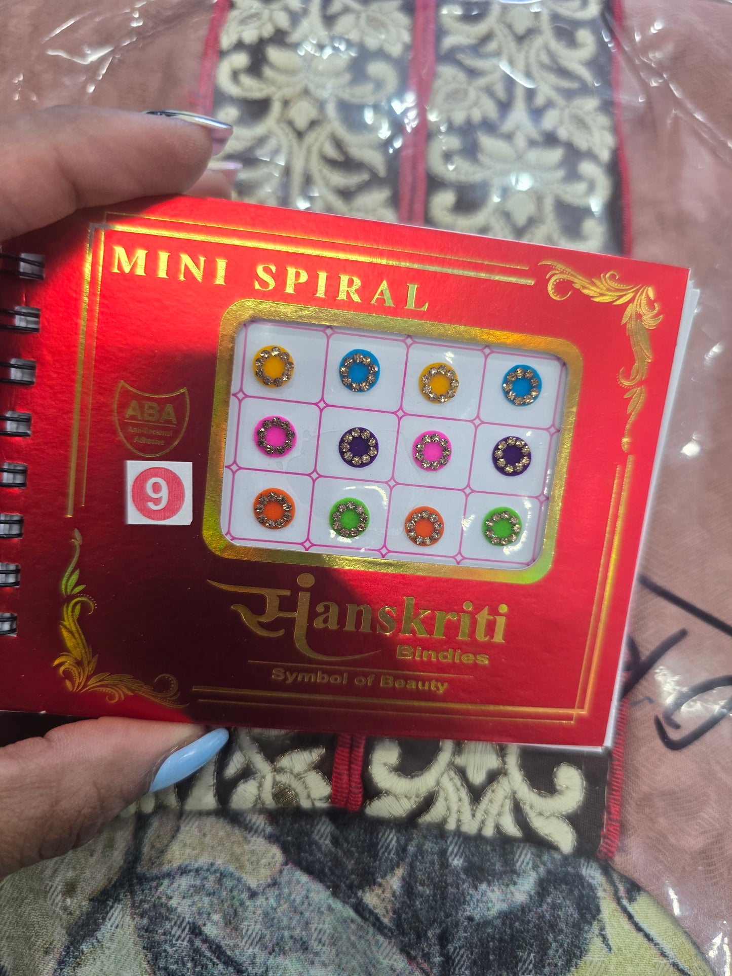Beautiful designer gold stone tikka/bindi book