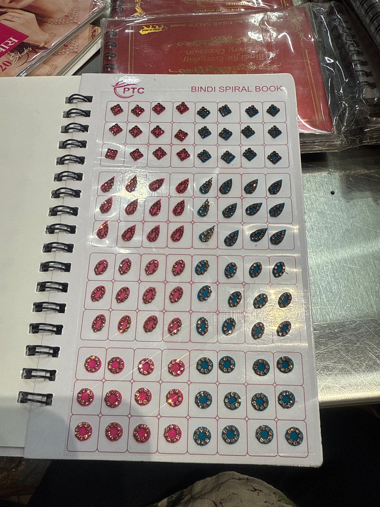 Beautiful designer gold stone tikka/bindi book