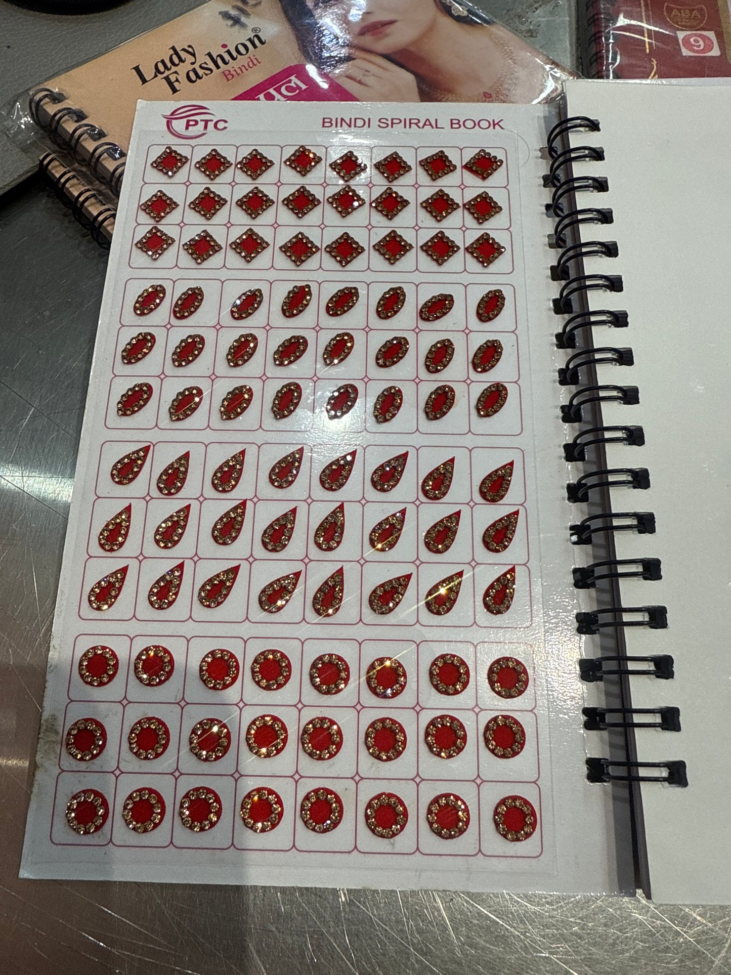 Beautiful designer gold stone tikka/bindi book