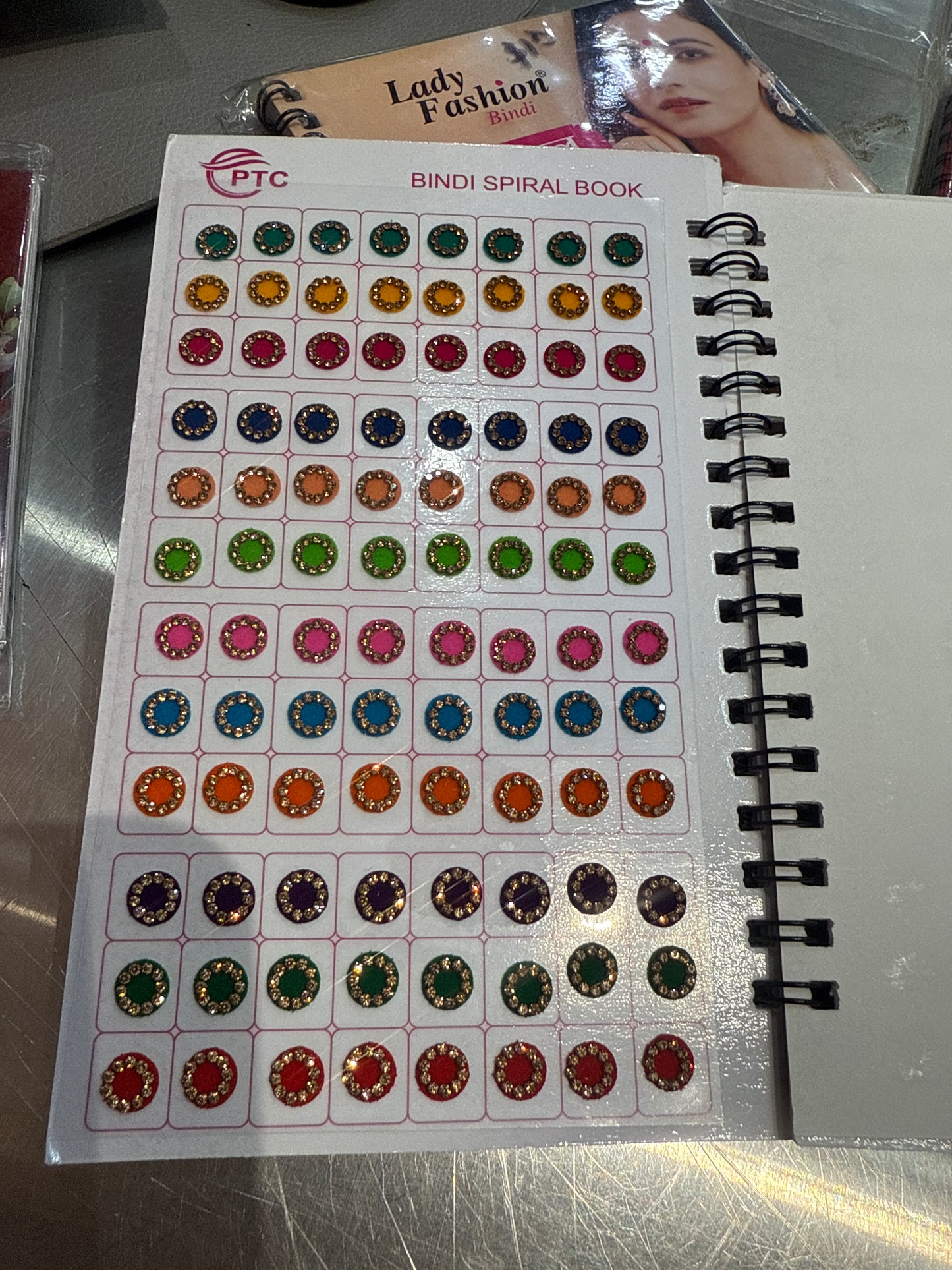 Beautiful designer gold stone tikka/bindi book