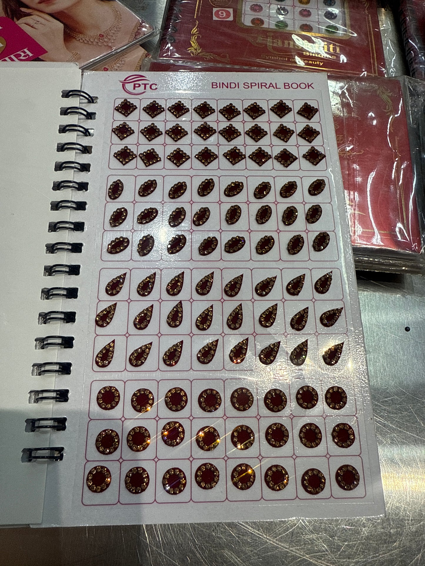 Beautiful designer gold stone tikka/bindi book