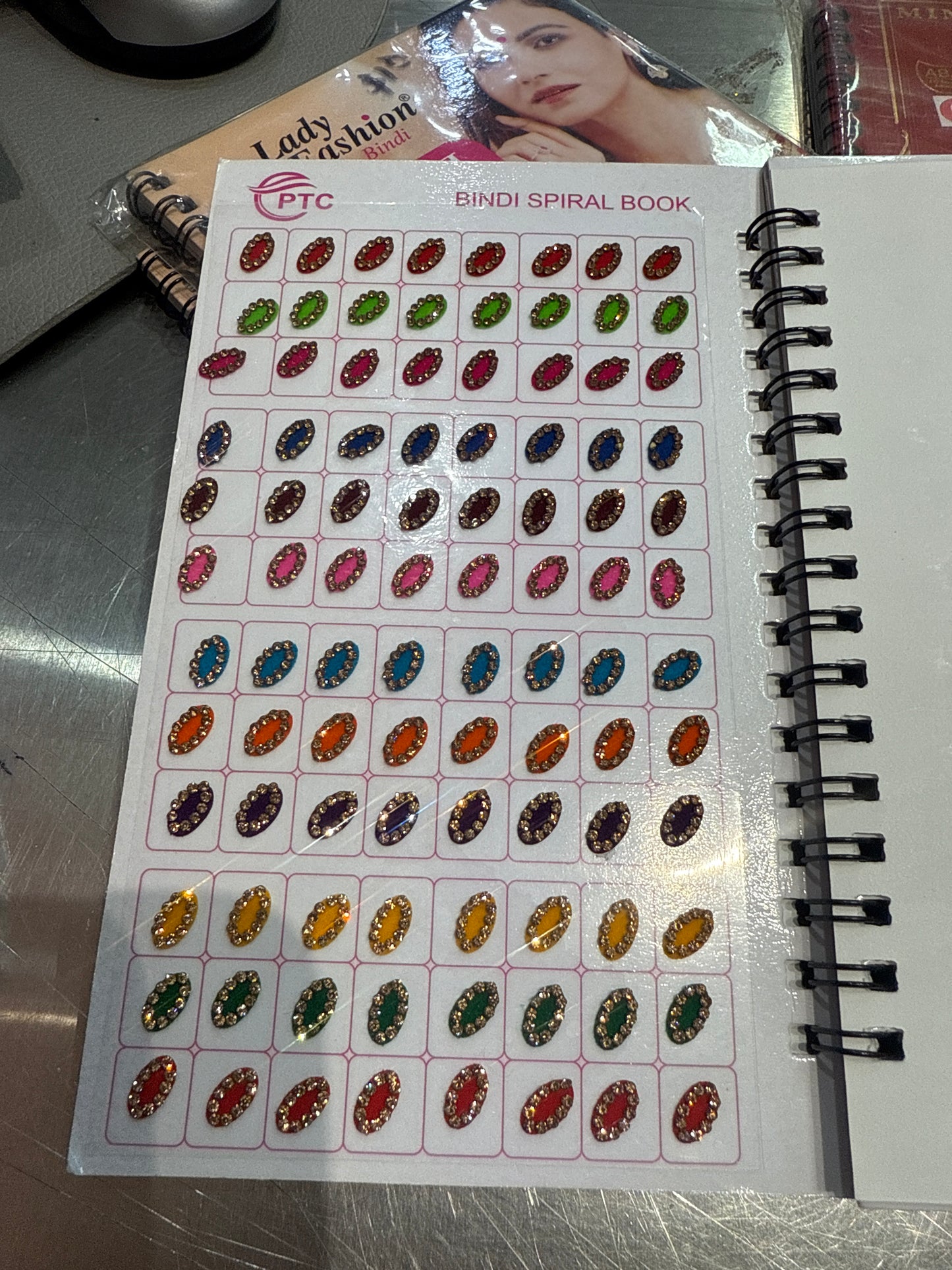 Beautiful designer gold stone tikka/bindi book