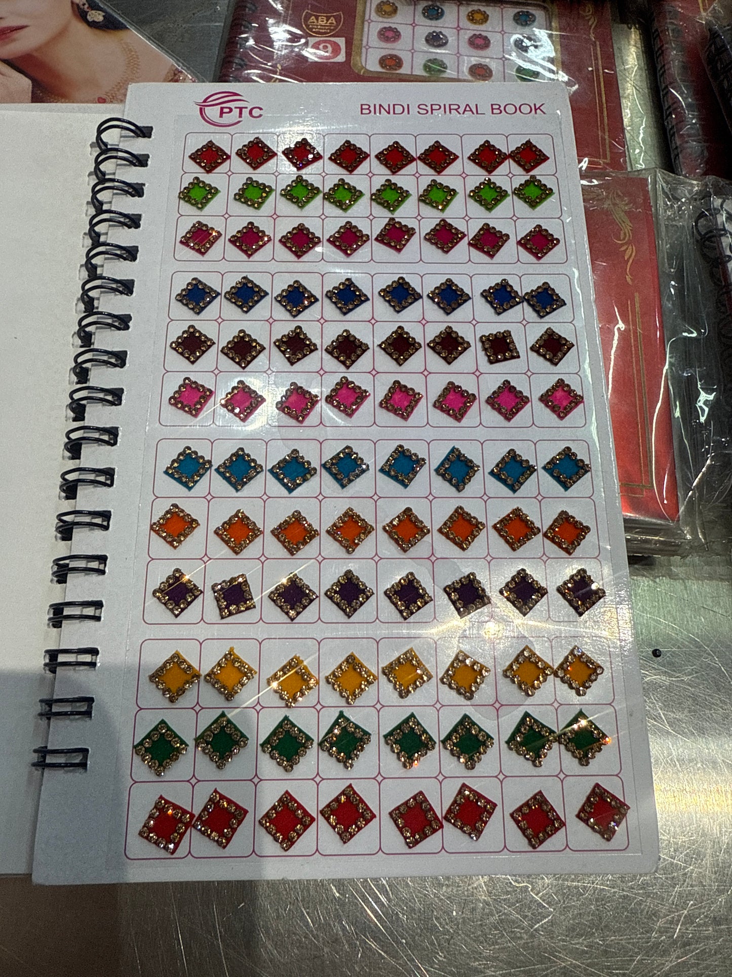 Beautiful designer gold stone tikka/bindi book