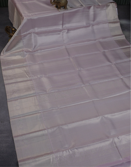 Beautiful Pure kanchipuram tissue silk saree pastel lavender shade with allover silver zari woven brocade weaves and silver zari woven border