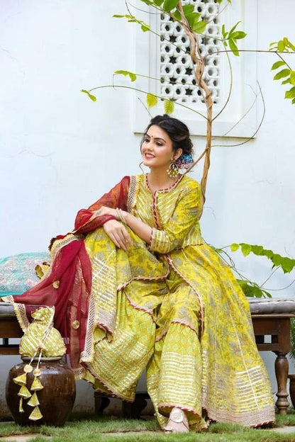 Beautiful designer sharara suit with matching potli