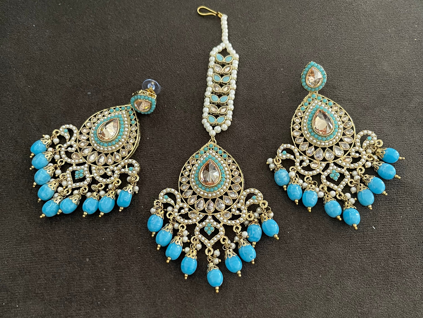 Beautiful designer polki earrings with bindi/tikka